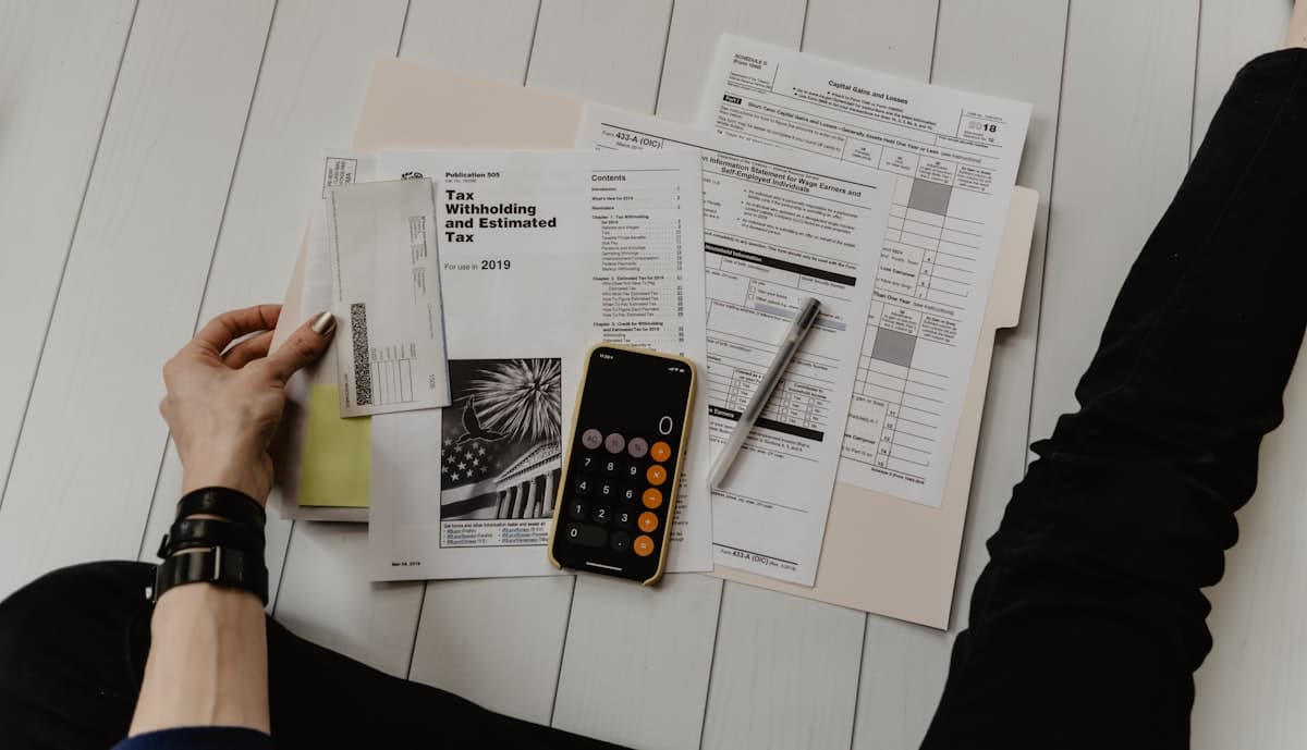 Finance paperwork and a calculator on a desk